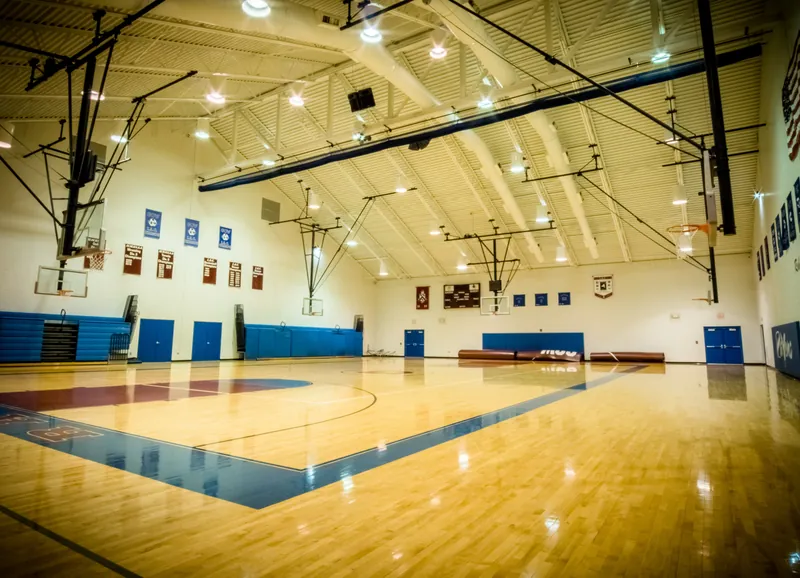 The basketball courts inside the Gow Center, with blue banners along the walls