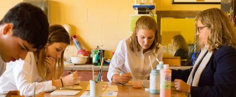 Art students painting in the Reid Art Center studio